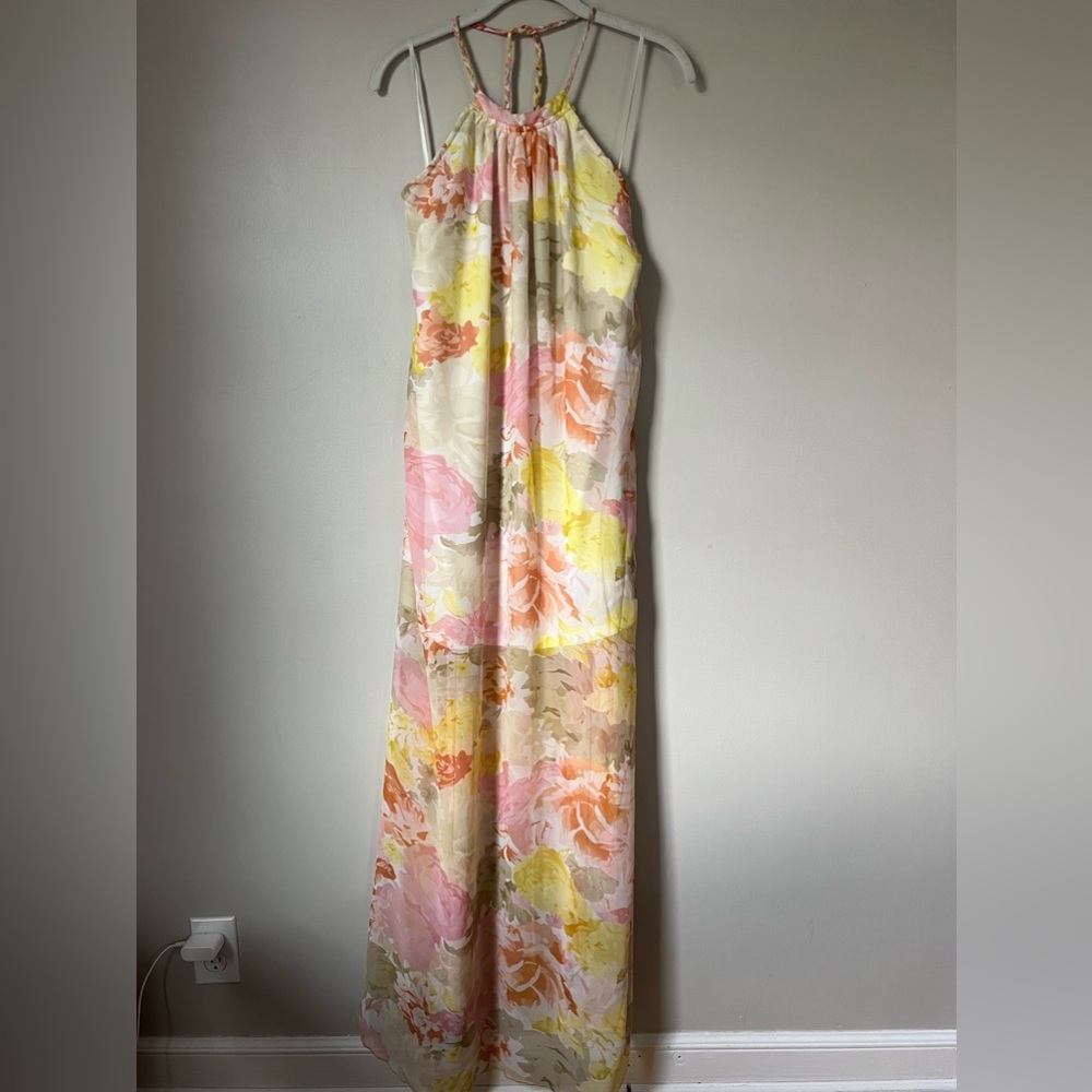 Halter dress with beautiful pastel floral pattern and braided ties. Size Small